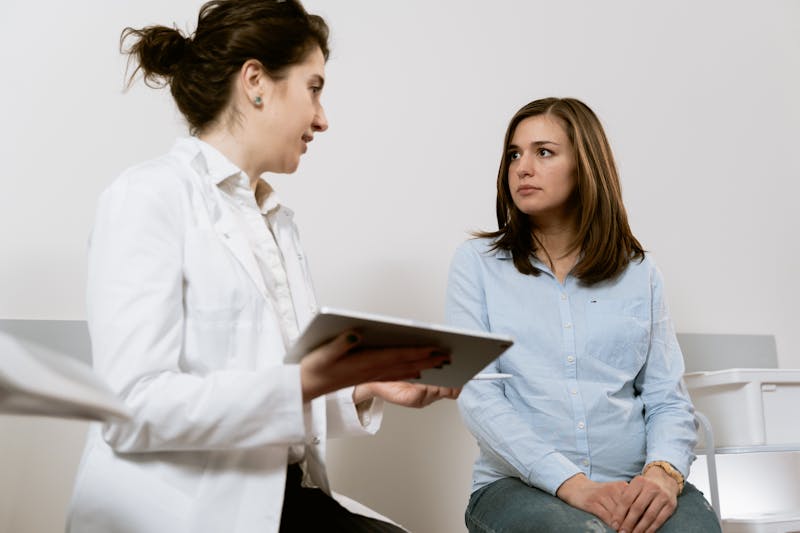 Caregiver checking a blood sugar reading for a client at home