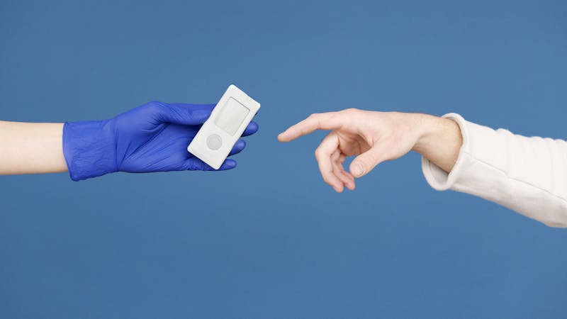 RN demonstrating insulin administration technique to a caregiver
