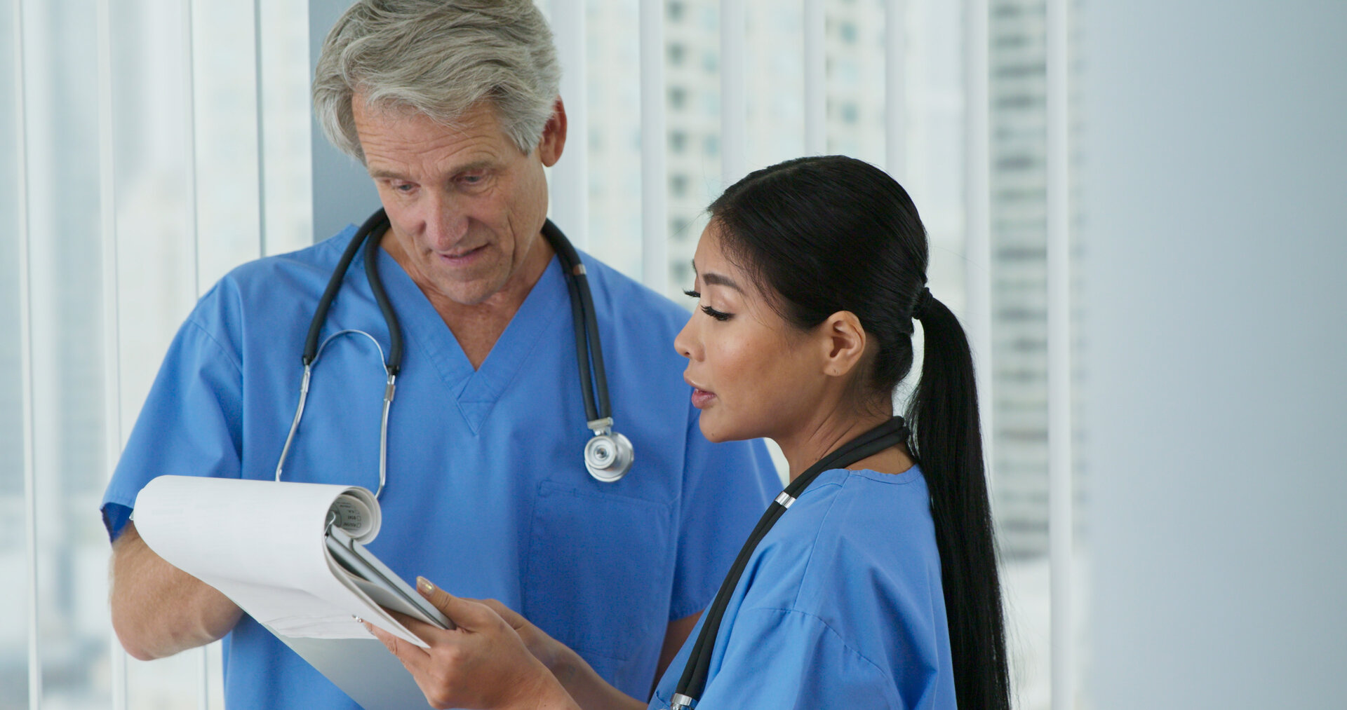 Healthcare professionals reviewing delegation documentation